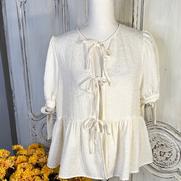 Elegant Cream Textured Women's Top with Bow Details - Picture 1 of 10